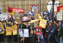 Striking sixth form teachers massed outside parliament yesterday against Tory cuts to education