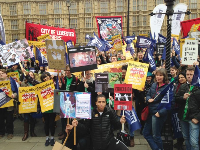 Striking sixth form teachers massed outside parliament yesterday against Tory cuts to education