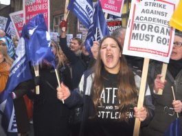 Teachers vent their anger last Wednesday night outside the Department of Education