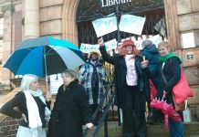 Supporters of the Carnegie Library in Lambeth gather outside on Saturday night in support of the round-the-clock occupation inside the building