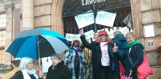Supporters of the Carnegie Library in Lambeth gather outside on Saturday night in support of the round-the-clock occupation inside the building