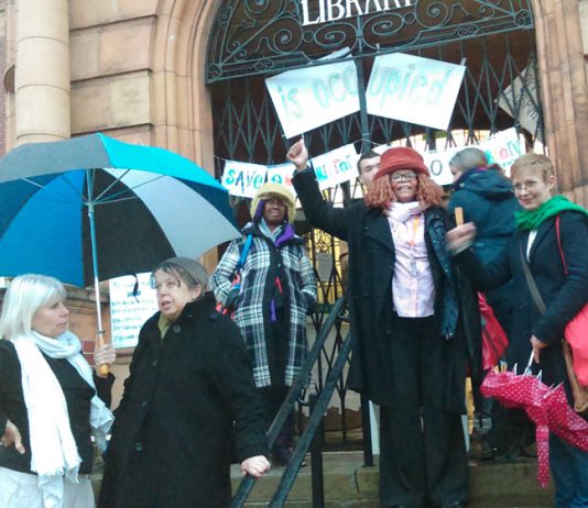 Supporters of the Carnegie Library in Lambeth gather outside on Saturday night in support of the round-the-clock occupation inside the building