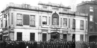 The Irish Citizens Army on parade outside Liberty Hall with their famous ‘We serve neither King nor Kaiser’ banner