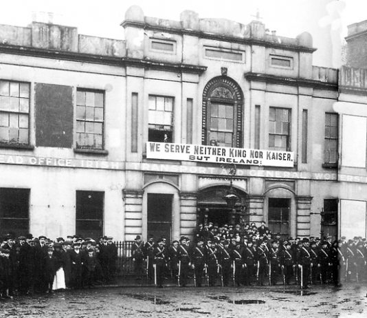 The Irish Citizens Army on parade outside Liberty Hall with their famous ‘We serve neither King nor Kaiser’ banner