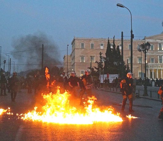 Greek riot police on Sunday night attacked protesters, who fought back with petrol bombs in scenes which resembled a war zone. Photo credit: MARIOS LOLOS