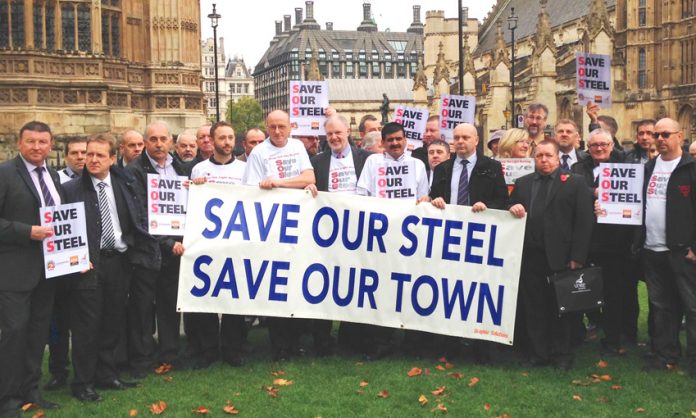 Port Talbot steel workers outside parliament demanding action to save the steel industry – a thousand march tomorrow
