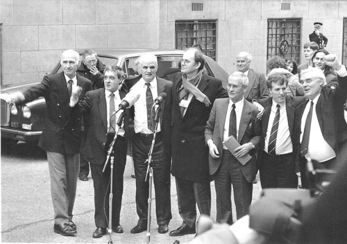 JOHN WALKER, PADDY HILL, HUGH CALLAGHAN, Labour MP CHRIS MULLEN, RICHARD McILKENNY, GERRY HUNTER and BILLY POWER outside the Old Bailey after their convictions for the Birmingham pub bombings were quashed on March 14, 1991