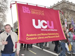 Bristol University UCU members with their banner on a TUC demonstration against austerity – they are on strike over pay tomorrow
