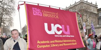 Bristol University UCU members with their banner on a TUC demonstration against austerity – they are on strike over pay tomorrow