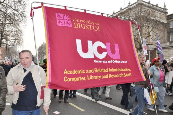 Bristol University UCU members with their banner on a TUC demonstration against austerity – they are on strike over pay tomorrow