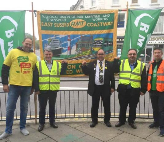RMT General Secretary MICK CASH (second from left) on the picket line at Eastbourne during the Southern rail strike on June 21st