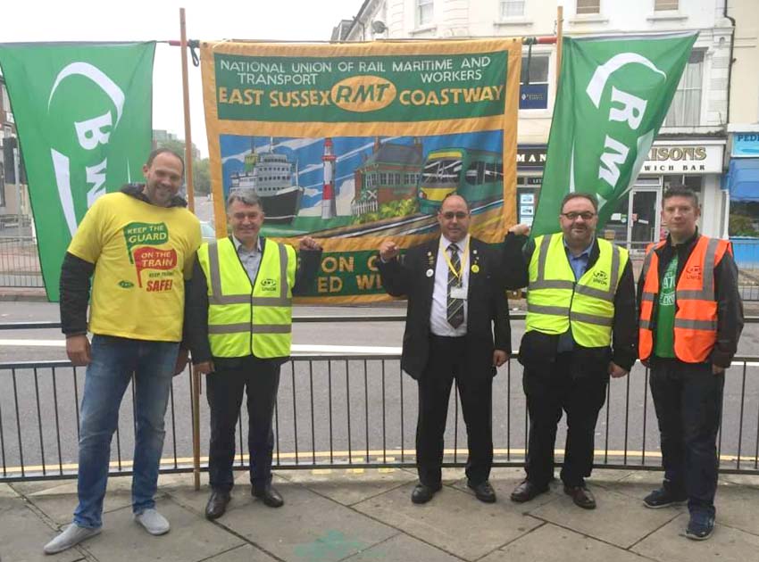 RMT General Secretary MICK CASH (second from left) on the picket line at Eastbourne during the Southern rail strike on June 21st