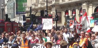 Thousands of teachers march through central London yesterday during their nationwide strike against savage cuts