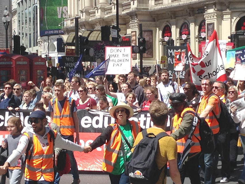 Thousands of teachers march through central London yesterday during their nationwide strike against savage cuts