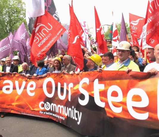 Steel workers march past parliament in May demanding action to save the steel industry