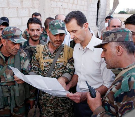 Syrian President bashar al-assad with troops last month
