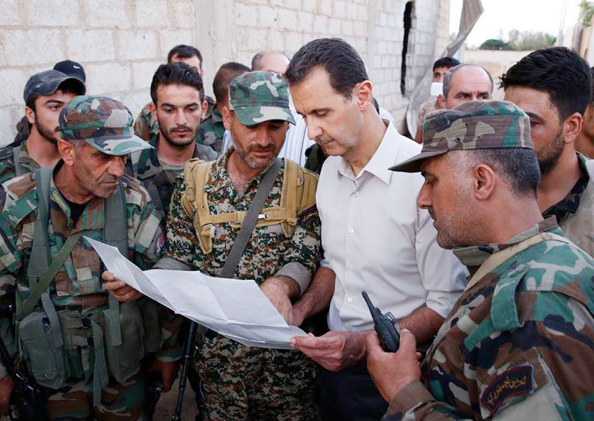 Syrian President bashar al-assad with troops last month