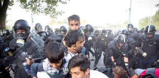 Hungarian police attack refugees on the border with Serbia. Photo credit: DAVID MAURICE SMITH