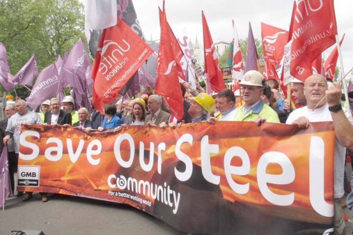 Labour leader CORBYN marching with steelworkers in London in May