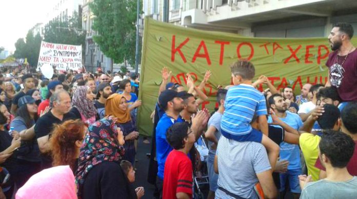 Refugees demonstrate on Thursday evening in Athens against police raids Photo credit: NASEEM LOMANI/KIRIAKI KROK