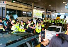 British police working with the French government taking action to stop a convoy boarding a ferry going to Calais