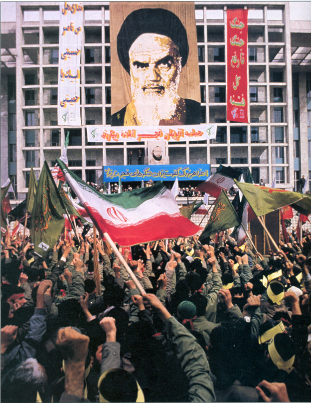 Portrait of Ayatollah Ruhollah Khomeini above a rally in Tehran marking the dispatch of forces to the front