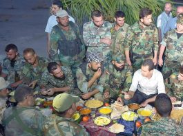 Assad breaks his fast with Syrian troops during Ramadan