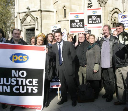 PCS leader MARK SERWOTKA (centre) at a rally against cuts