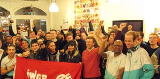 Deliveroo riders at Tuesday night’s meeting with the Independent Workers Union of Great Britain banner