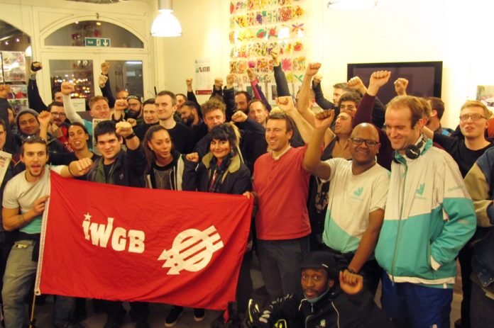 Deliveroo riders at Tuesday night’s meeting with the Independent Workers Union of Great Britain banner