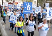 Workers from Huddersfield Royal Infirmary marching to 10 Downing Street to tell PM May that their hospital must remain open and fully functioning