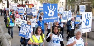 Workers from Huddersfield Royal Infirmary marching to 10 Downing Street to tell PM May that their hospital must remain open and fully functioning