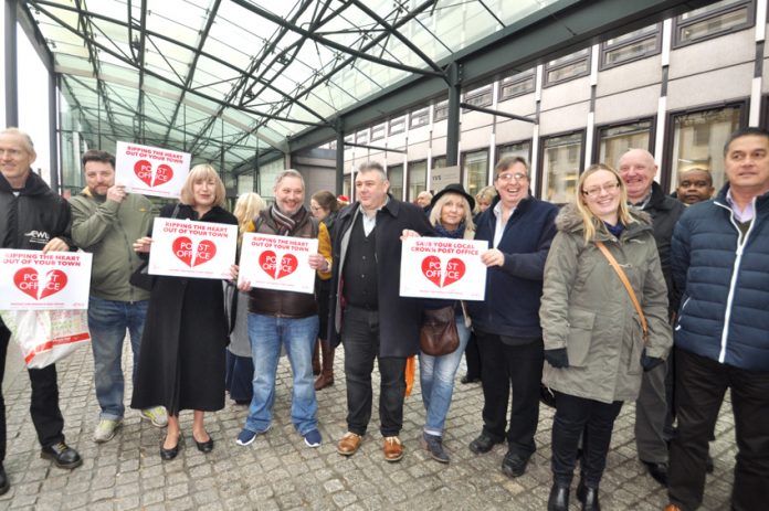 Postal workers among the 100-strong rally outside the Department of Business, Energy and Industrial Strategy demanding no closures of Crown Post Offices