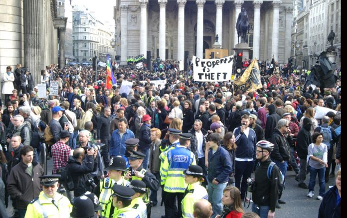 Workers demonstrate outside the Bank of England in 2009 – they are still paying the price for the bankers’ crash