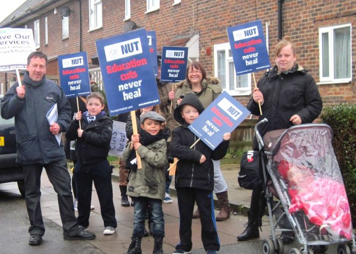 Teachers, parents and school pupils demonstrate in Bellingham in south east London against vicious education cuts