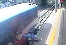 Passenger with hand trapped in train door being dragged along the platform