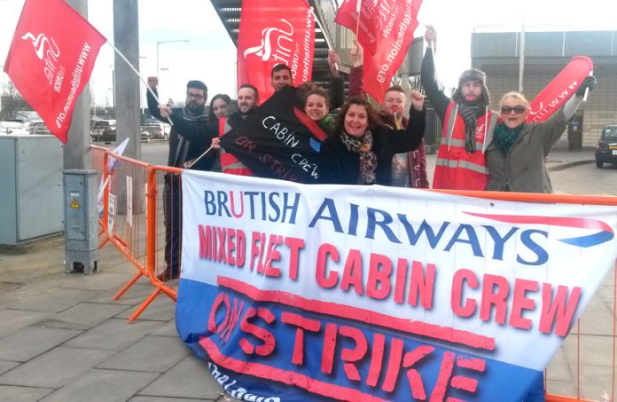 Striking BA mixed fleet cabin crew on the picket line at Heathrow Airport yesterday during their latest 4-day strike over pay