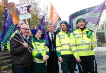 NHS ambulance workers picket their London HQ over wages and jobs