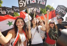 Syrian girls demonstrating in London demanding that the imperialist powers keep their hands off Syria