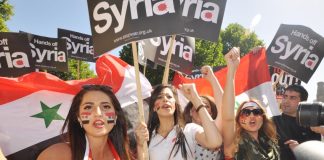 Syrian girls demonstrating in London demanding that the imperialist powers keep their hands off Syria