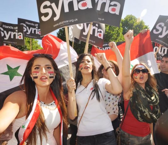 Syrian girls demonstrating in London demanding that the imperialist powers keep their hands off Syria