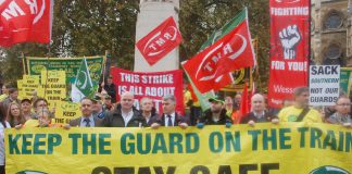 RMT and supporters demonstrate outside the House of Commons for passenger safety, insisting guards must be kept on the trains