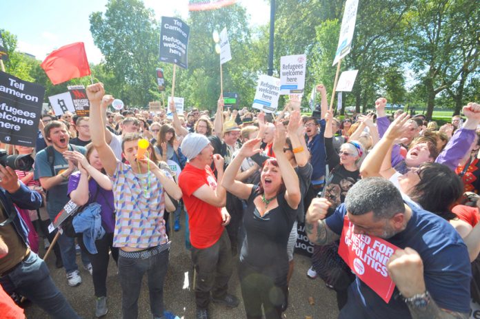 Crowds of supporters celebrate the election of Jeremy Corbyn as Labour Party leader at the Refugees Welcome march in September 2015