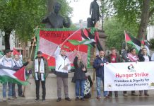 Palestinian AYSAR SHAMALLAKH (centre in white jacket) on hunger strike in solidarity with over 1,600 hunger-striking Palestinian prisoners in Israeli jails. Picture shows Aysar and supporters demonstrating in Parliament Square on Wednesday evening