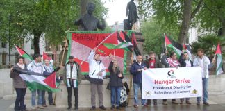 Palestinian AYSAR SHAMALLAKH (centre in white jacket) on hunger strike in solidarity with over 1,600 hunger-striking Palestinian prisoners in Israeli jails. Picture shows Aysar and supporters demonstrating in Parliament Square on Wednesday evening