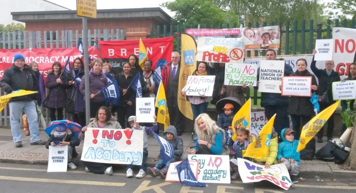 Parents pupils and teachers demonstrate against academies – Academies Enterprise Trust (AET) plan to sack caretakers and others to save £1.4m
