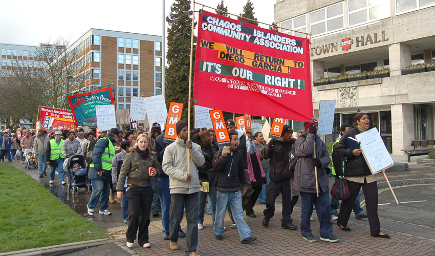 Chagos Islanders marching in Crawley, Sussex – they demand the right to return to their home islands