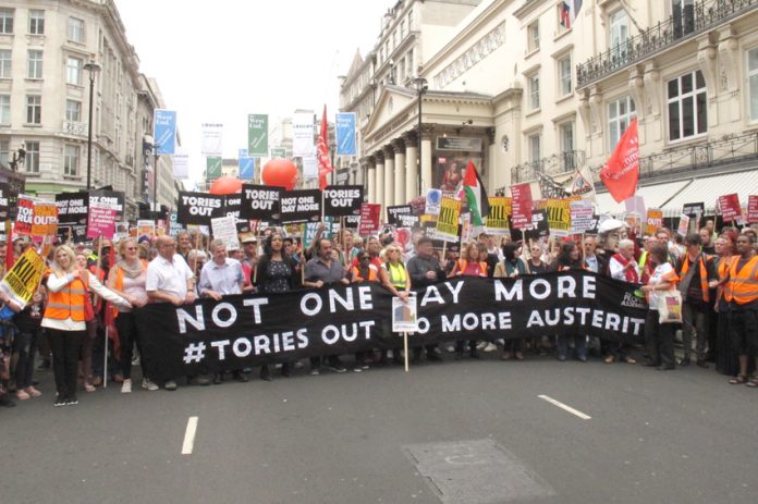 London anti-Theresa May march lead banner