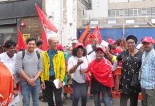 Junior doctors leader JEEVES WIJESURIYA (2nd left) joins SERCO strikers yesterday on the picket line at the Royal London Hospital