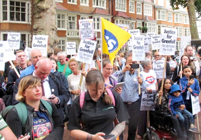 Crowds assemble outside the Kensington Council meeting where Grenfell Tower survivors told the councillors to resign